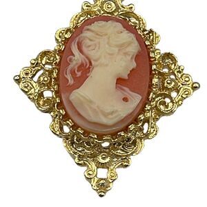 Vintage Gerry’s cameo brooch with ornate frame.